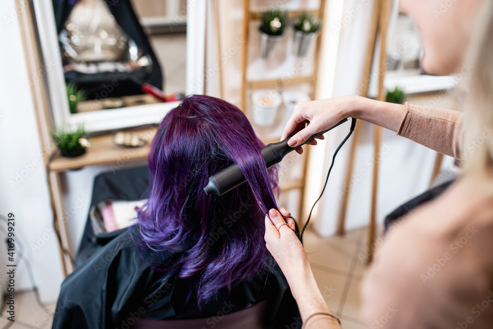 Beautiful hairstyle of young adult woman with purple hair in hair salon. Beautiful hairstyle of young adult woman with purple hair in hair salon.
