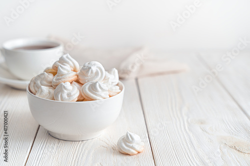Swiss meringues on a soft light background. Side view