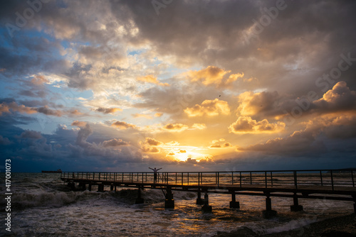 sunset over the sea and pier