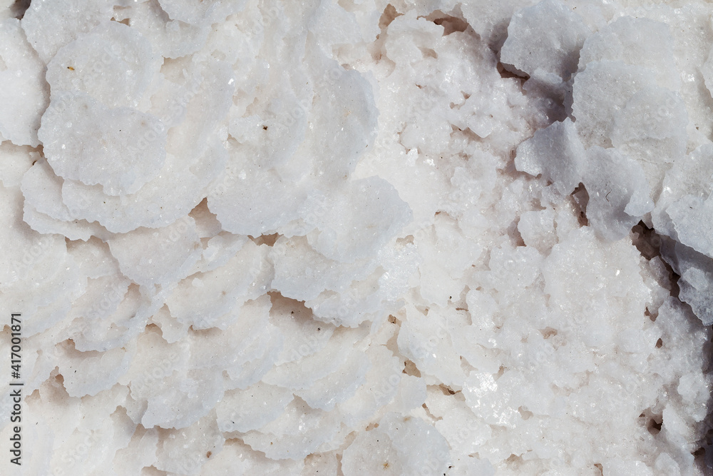 Pink salt in salt lake as textured background. Salt background. Pink salt in salt lake as textured background. Salt background.