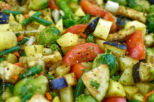 Vegetable stew, close-up. Vegetarian food, juicy vegetables. Texture of fresh chopped vegetables