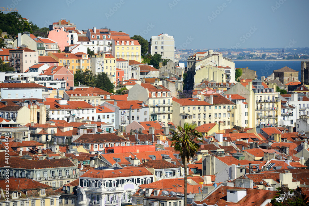 Alfama district and Tagus River, from Miradouro de Sao Pedro de Alcantara in city of Lisbon, Portugal.