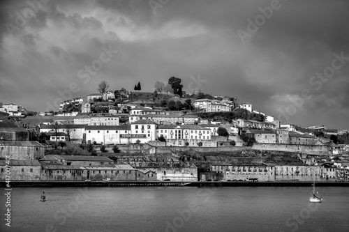 View of the old tiled roofs of the old city of Porto from the Vila Nova de Gaia side. Portugal. Black and white