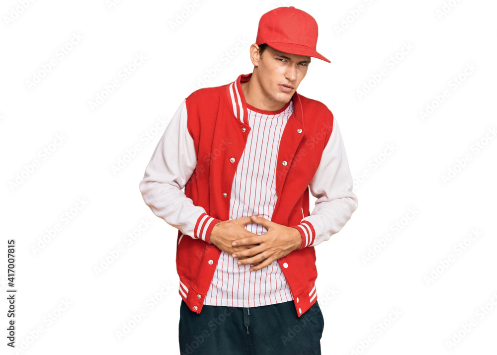 Handsome caucasian man wearing baseball uniform with hand on stomach because indigestion, painful illness feeling unwell. ache concept. Handsome caucasian man wearing baseball uniform with hand on stomach because indigestion, painful illness feeling unwell. ache concept.