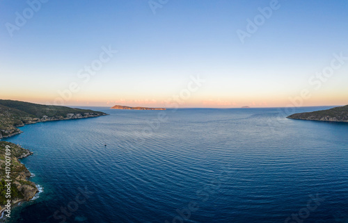 Aerial drone shot of Adriatic sea Bisevo island from Komiza Vis Island view in Croatia summer before sunrise