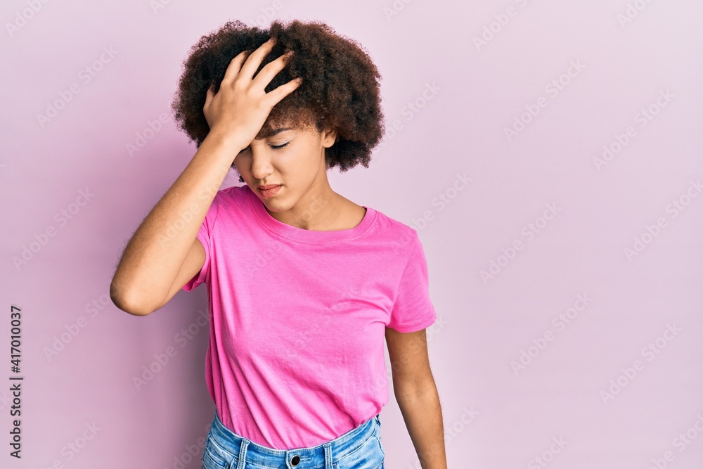 Young hispanic girl wearing casual clothes surprised with hand on head for mistake, remember error. forgot, bad memory concept. Young hispanic girl wearing casual clothes surprised with hand on head for mistake, remember error. forgot, bad memory concept.
