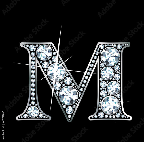 A stunningly beautiful "M" set in diamonds and silver.