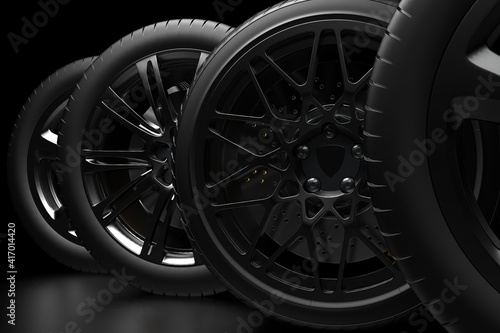 auto wheels on a dark background with chrome rims. 3d render © evgeniy