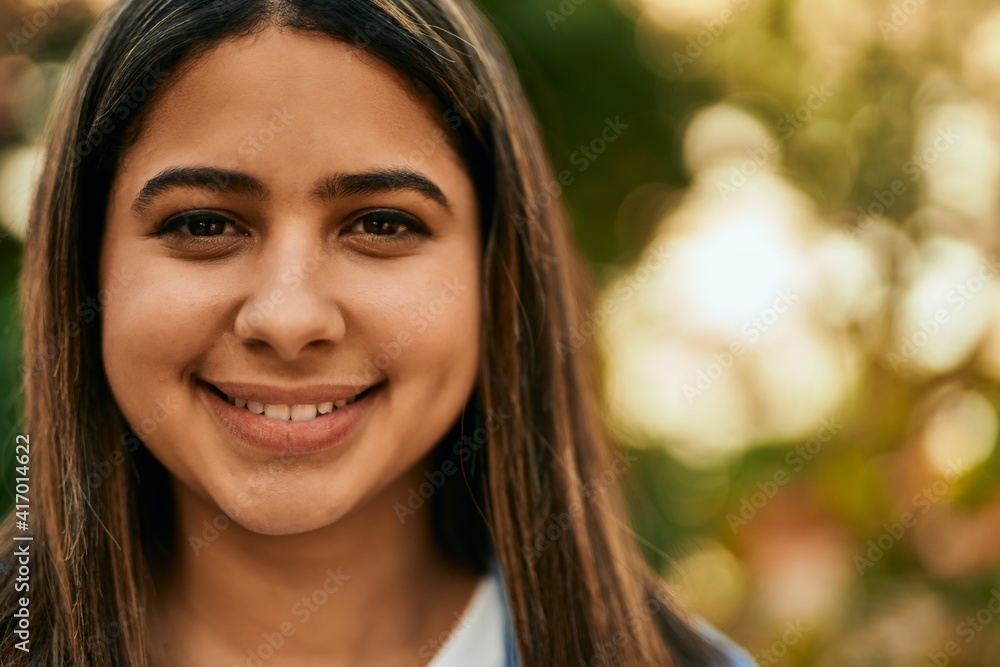 Young latin girl smiling happy standing at the city. Young latin girl smiling happy standing at the city.