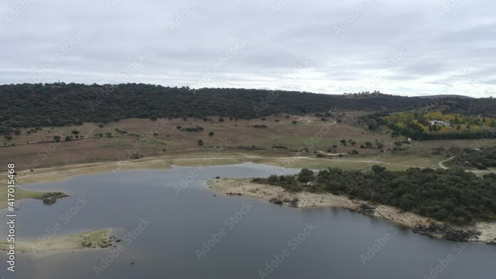 Drone aerial view of Idanha Dam Marechal Carmona landscape with beautiful blue lake water, in Portugal Drone aerial view of Idanha Dam Marechal Carmona landscape with beautiful blue lake water, in Portugal