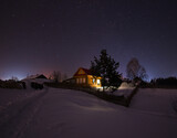 snow covered house at night