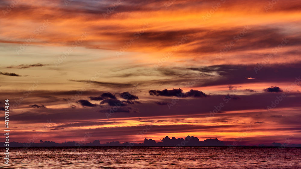 Cuba. Trinidad. Burning crucible of sunset over the beach