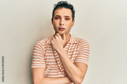 Obraz na plátně Handsome man wearing make up wearing casual shirt thinking attitude and sober ex