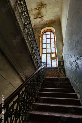 Old vintage staircase at the old abandoned building