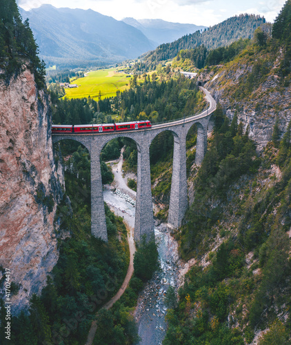 Aerial view of red train passing the Landwasser viaduct, Switzerland  photo