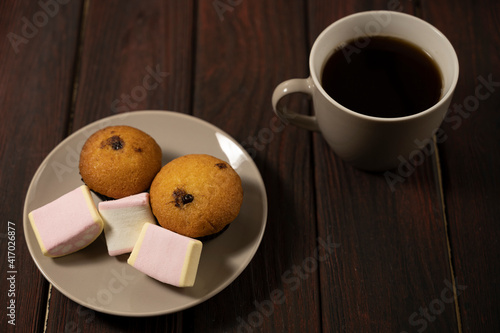 Coffee with muffins and marshmallows