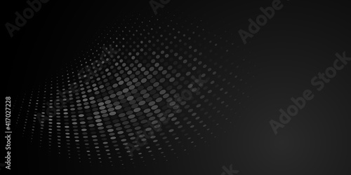 Abstract background made of halftone dots in black and gray colors