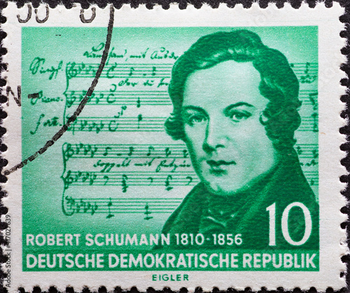 GERMANY, DDR - CIRCA 1956  : a postage stamp from Germany, GDR showing a half-length portrait of Robert Schumann. From mistaken notes by Franz Schubert. 100th anniversary of Robert Schumann's death photo