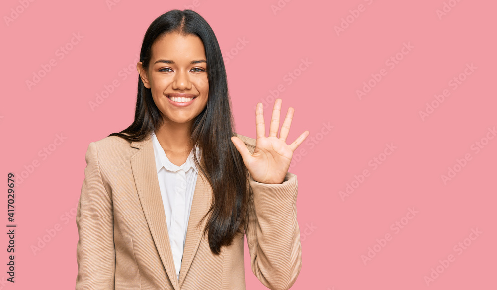 Beautiful hispanic woman wearing business jacket showing and pointing up with fingers number five while smiling confident and happy. Beautiful hispanic woman wearing business jacket showing and pointing up with fingers number five while smiling confident and happy.