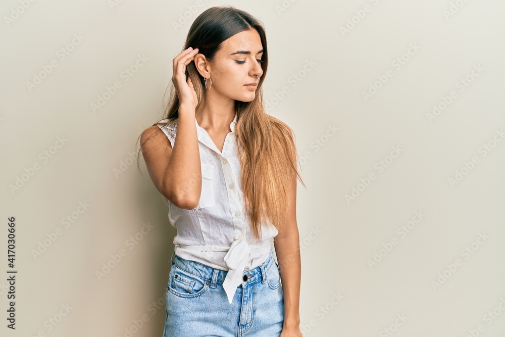 Beautiful young woman standing confident looking at the camera Beautiful young woman standing confident looking at the camera