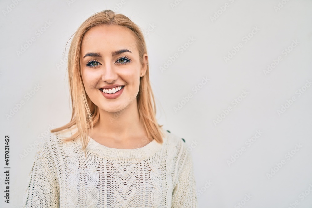 Young blonde girl smiling happy standing at the city. Young blonde girl smiling happy standing at the city.