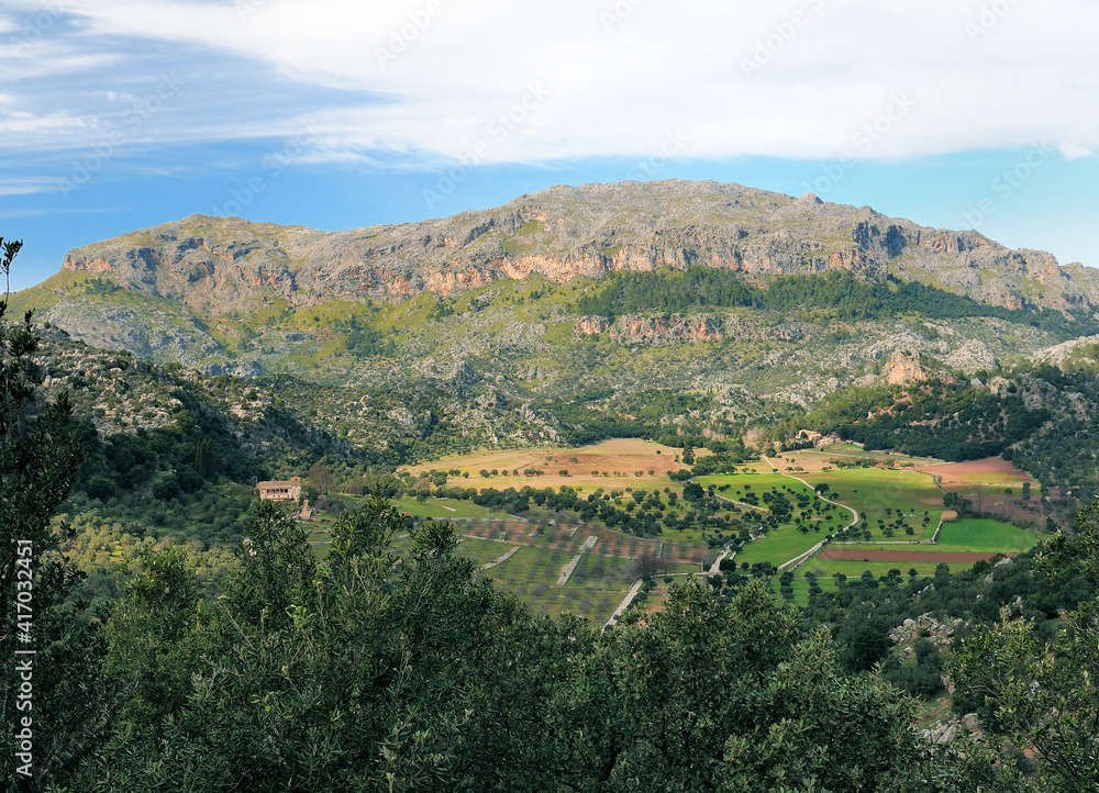 View From Lluc To The Fertile Valley Sa Plana On Balearic Island Mallorca On A Sunny Winter Day With A Few Clouds In The Blue Sky