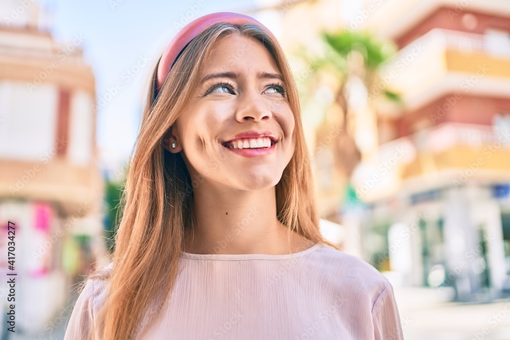 Young caucasian girl smiling happy walking at the city. Young caucasian girl smiling happy walking at the city.