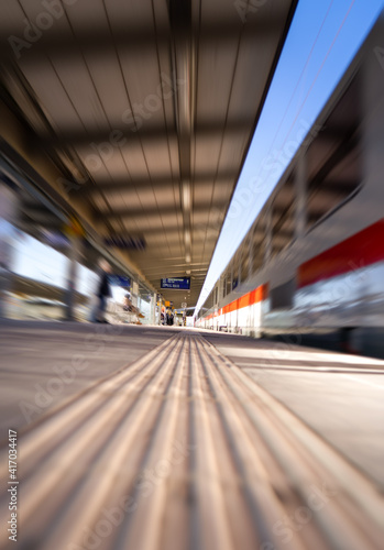 Fast moving train at station. Motion blur