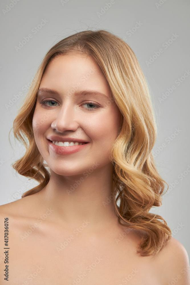 Pretty lady with clear skin posing with no makeup.