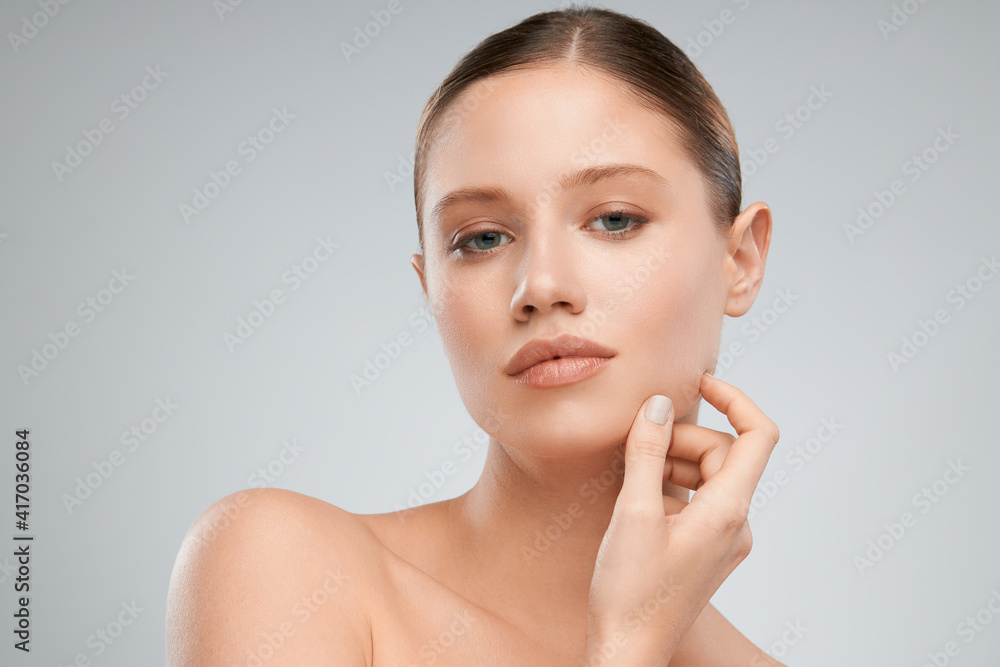 Gorgeous young woman posing with nude makeup. Beauty photography Gorgeous young woman posing with nude makeup. Beauty photography