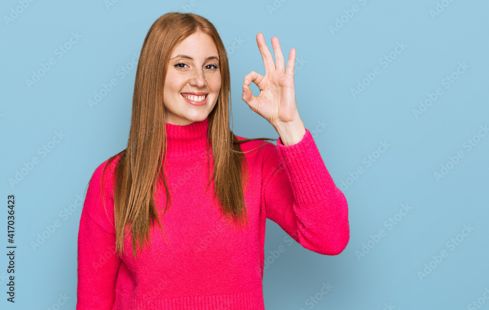 Young irish woman wearing casual clothes smiling positive doing ok sign with hand and fingers. successful expression. Young irish woman wearing casual clothes smiling positive doing ok sign with hand and fingers. successful expression.