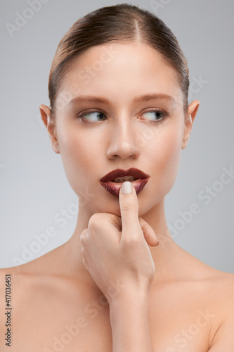 Beautiful lady posing with brown lipstick. Beauty photography