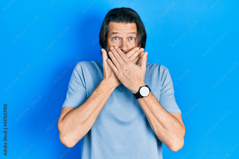 Middle age caucasian man wearing casual clothes shocked covering mouth with hands for mistake. secret concept. Middle age caucasian man wearing casual clothes shocked covering mouth with hands for mistake. secret concept.