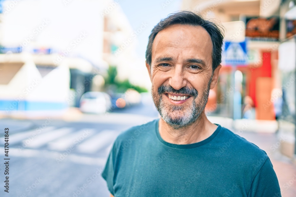 Middle age man with beard smiling happy outdoors Middle age man with beard smiling happy outdoors