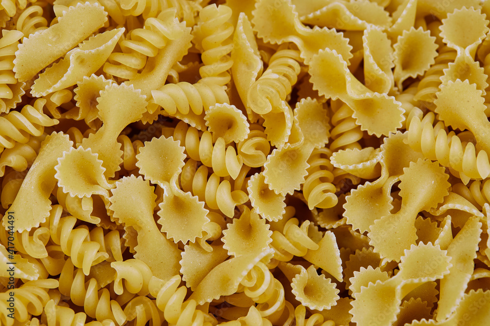 A bunch of mixed pasta scattered on table A bunch of mixed pasta scattered on table