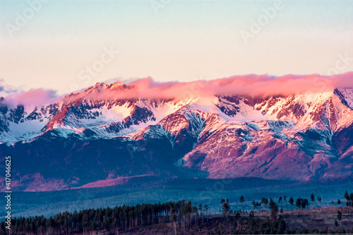 sunrise over the sayans mountains / pink clouds