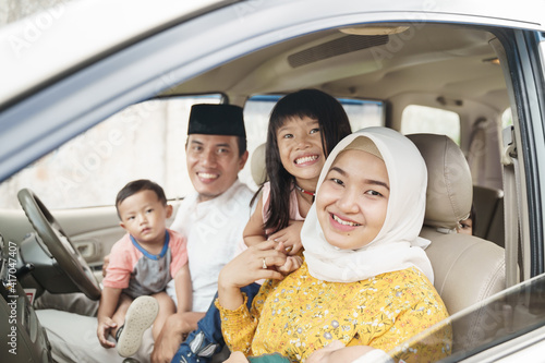 Photography Muslim family travel by car during eid mubarak celebration