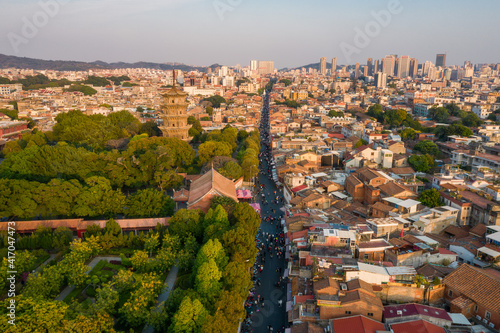 Aerial view of Kaiyuan Temple, the largest buddhist temple in Fujian Province, and West Street at dusk in Quanzhou, China