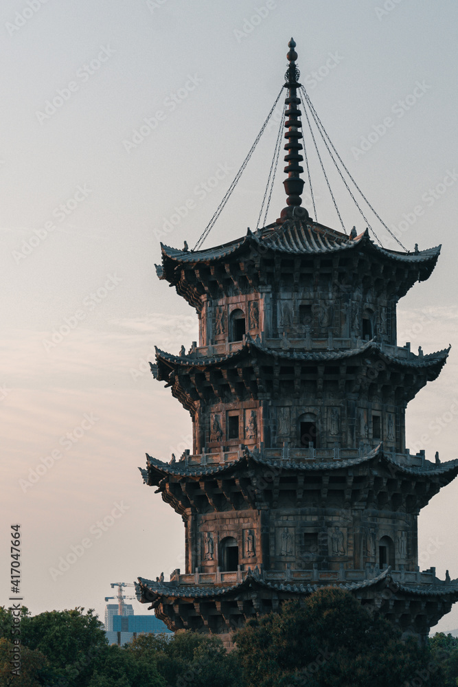 Detail view of Zhenguo Pagoda, the ancient stone pagoda in Kaiyuan Temple at dusk, largest Buddhist temple in West Street, Quanzhou, China Detail view of Zhenguo Pagoda, the ancient stone pagoda in Kaiyuan Temple at dusk, largest Buddhist temple in West Street, Quanzhou, China
