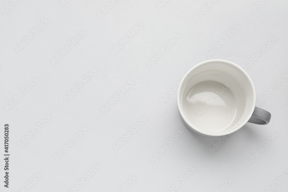 Empty cup on light background Empty cup on light background