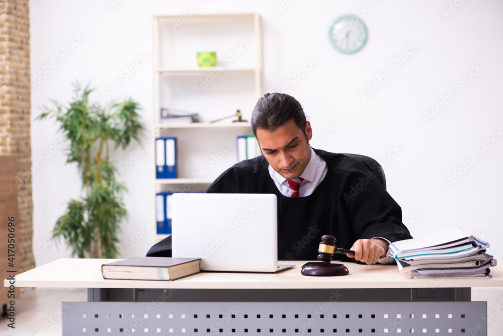 Young male lawyer working in the courthouse Young male lawyer working in the courthouse