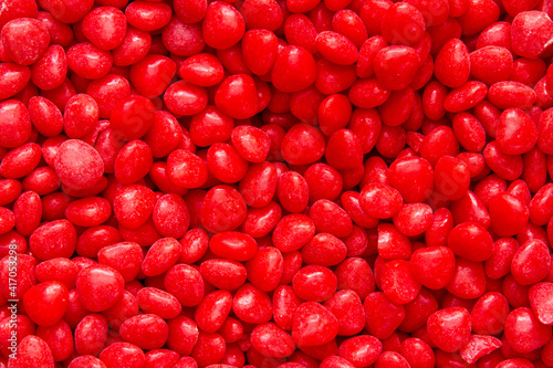Bright Red Cinnamon Heart Texture; many cinnamon hearts in a pile