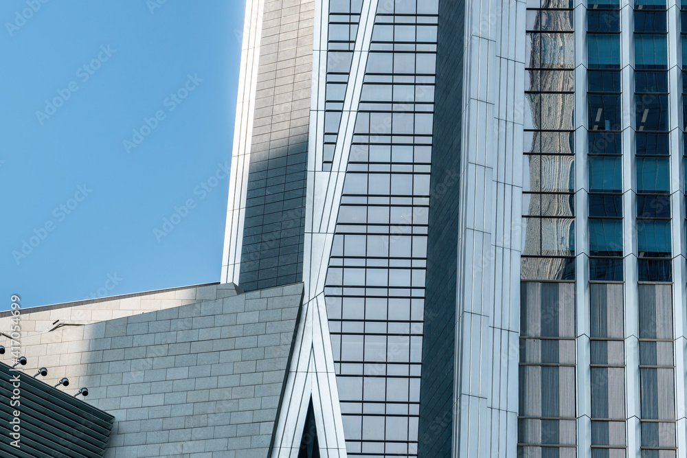 Low angle shot of exterior glass of urban office building Low angle shot of exterior glass of urban office building