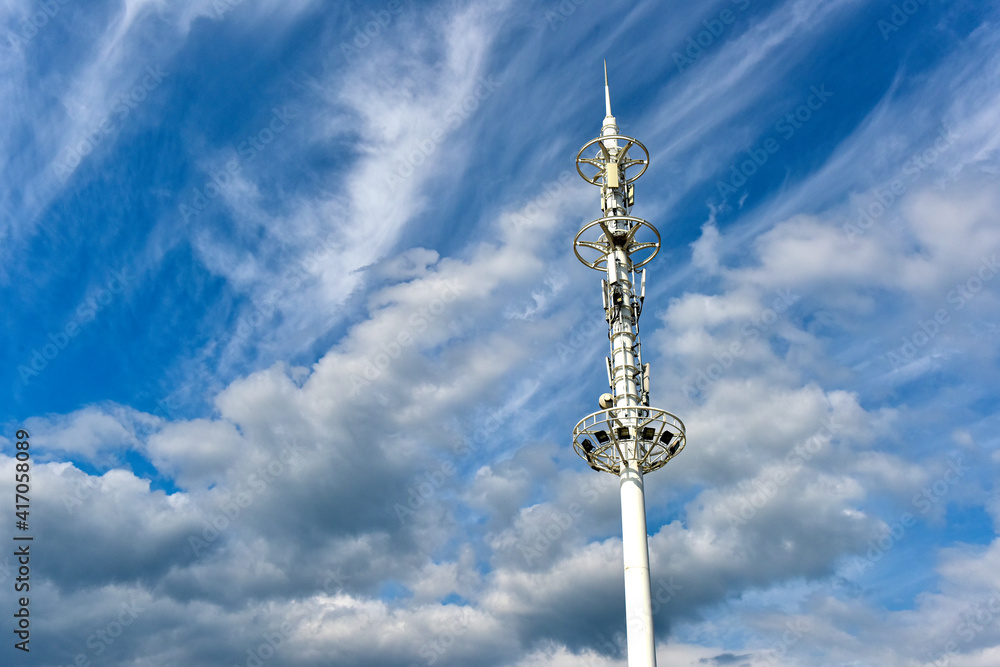 Wireless communication equipment on the shore under the background of blue sky and white clouds