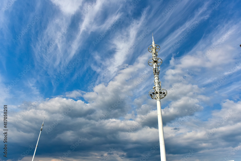 Wireless communication equipment on the shore under the background of blue sky and white clouds Wireless communication equipment on the shore under the background of blue sky and white clouds
