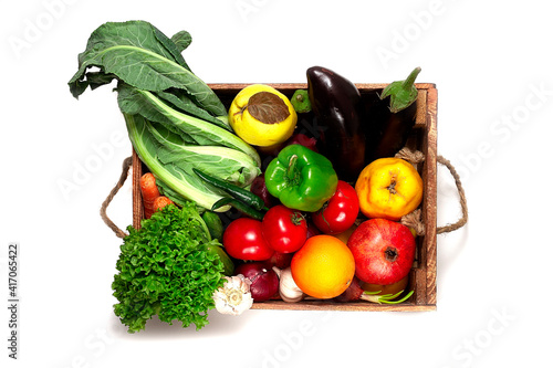 Fototapeta Naklejka Na Ścianę i Meble -  Assortment of fruits and vegetables, in a wooden box, close, horizontal, no people,