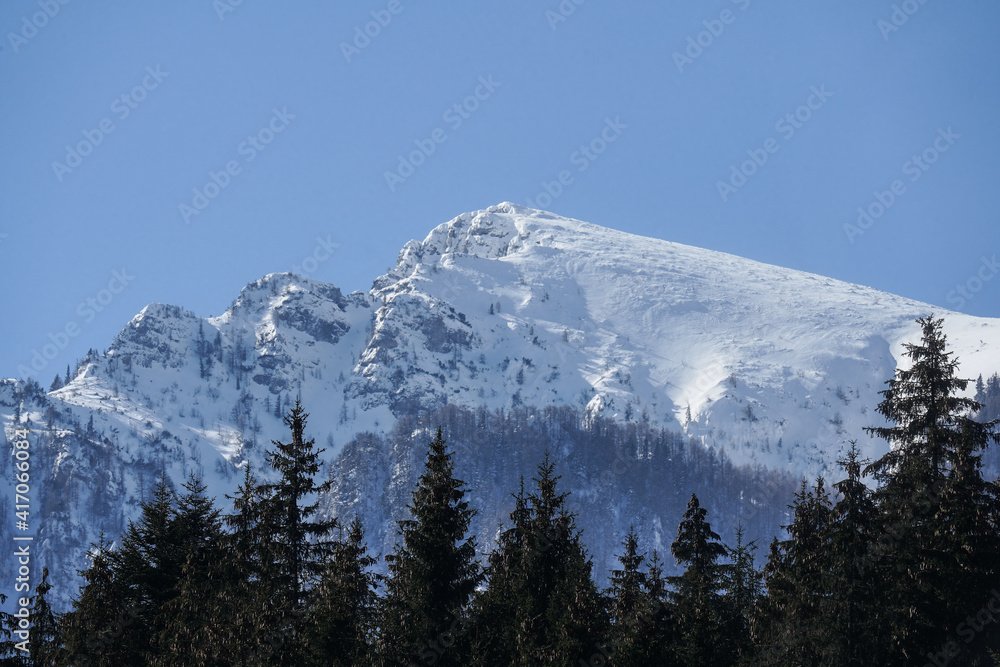 Mountain landscape in Bucegi National Park, Romania. Snowy mountain ridges.