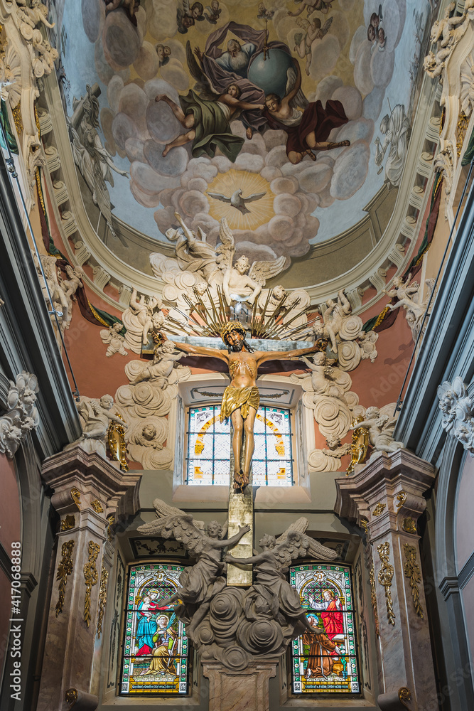 LVIV, UKRAINE - FEBRUARY 13, 2021: Interior of the Latin Cathedral. Chapel to Jesus Crucifixion, also called as the Jablonowki family chapel. The gothic crucifix is placed into the Baroque altar.