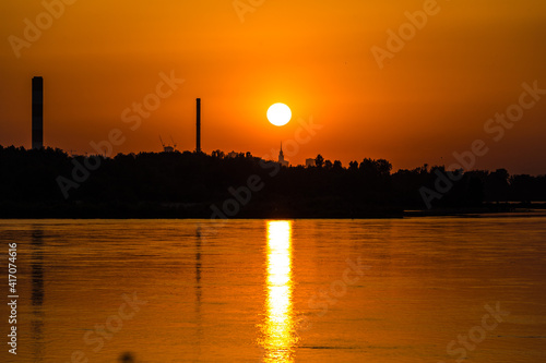 The sun over the Palace of Curture and Science on the Romantic Beach in Warsaw, Poland