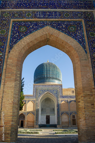 View of landmark Gur e Amir, mausoleum of Timur or Tamerlane through the entrance gate in UNESCO listed Samarkand, Uzbekistan